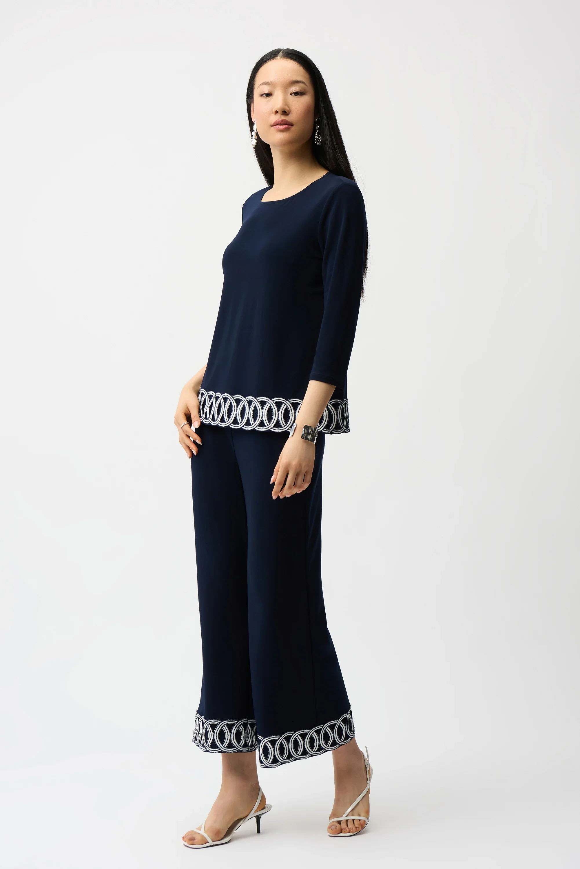 Silky Knit Fitted Top With Guipure Hem Detail
261069
